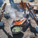 Salmon cooking over a fire