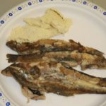 fish and potatoes on a plate