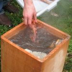 boiling water and cooking in a cedar box